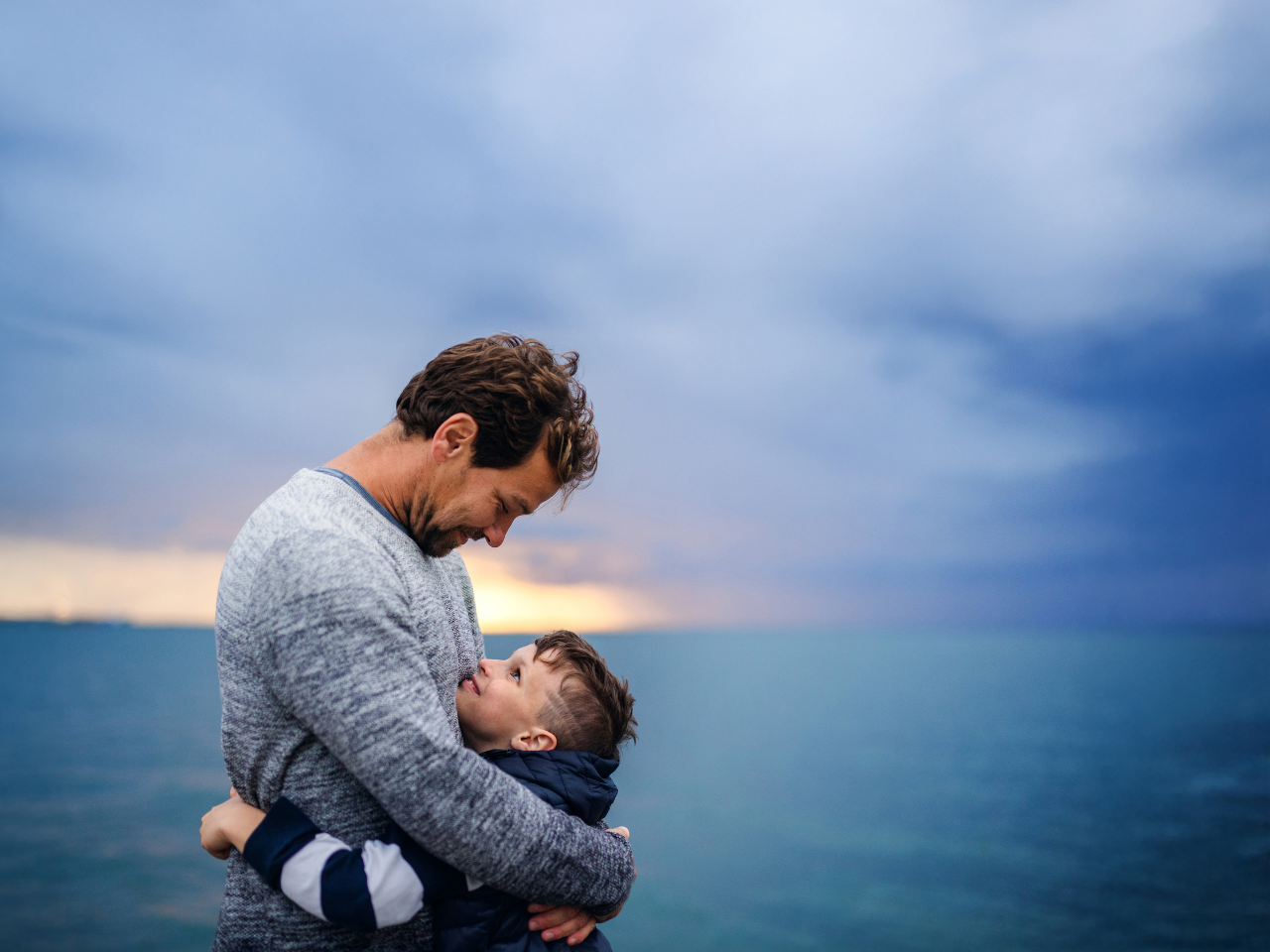 A father showing care for his son.